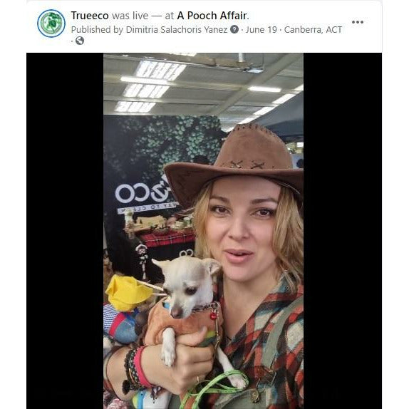 Girl Holding Dog with TRUEECO Banner at the Back - TRUEECO - Australia